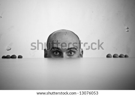 Black and white image of top of man\'s face looking stressed; caucasian/white, 31-45 years of age, bald
