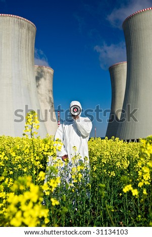 A metaphorical image of an environmental activist with a loudspeaker, protesting against a nuclear plant installation.