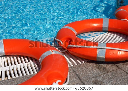 Life-belts near the water of a pool