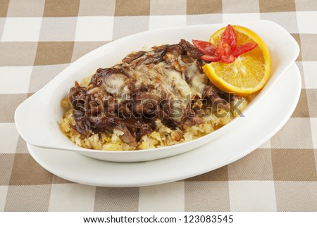 Beef and rice severed covered with a delicious sauce