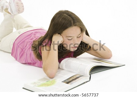Child working on homework on white background