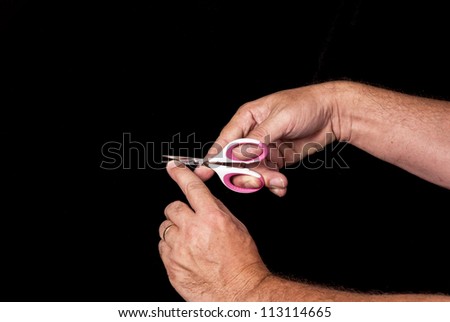 Scissors trimming human nails