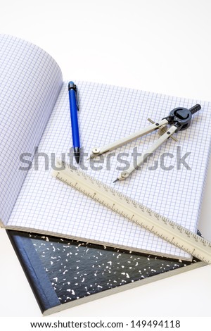 School supplies of compass and graphing paper