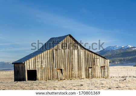 Farmers barn in a field winter