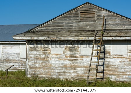 Old homestead building with a rickety old ladder