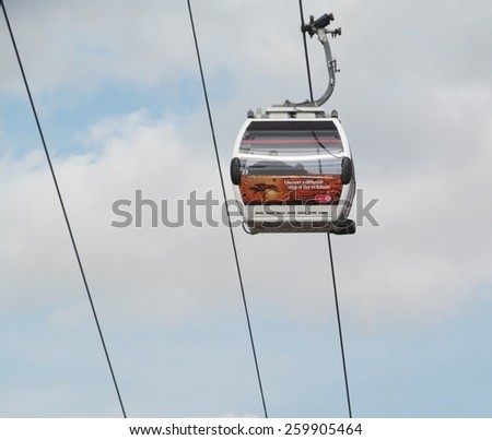 LONDON- 12 MARCH: People using londons newest river crossing, the emirates cable car, which crosses the river thames from greenwich to newham, and the excel centre, LONDON, 12 MARCH, 2015.