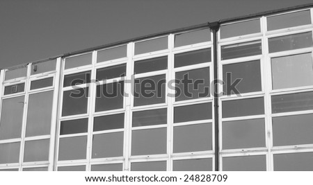 Square paneled building in black and white.
