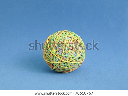 rubber band balls on blue background