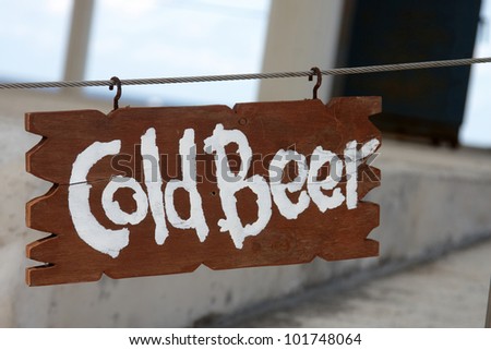 Cold Beer sign attached to a wire with hooks