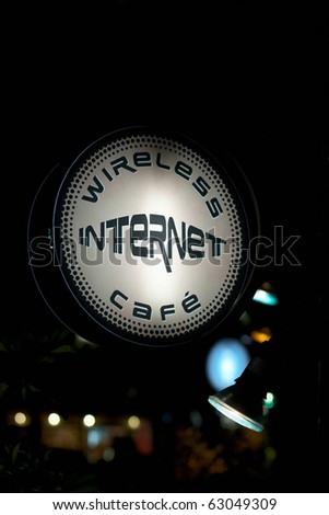 Illuminated sign for Internet cafe at night