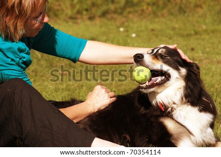 Dog and owner playing in the park