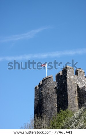 Pembroke Castle tower with a union jack