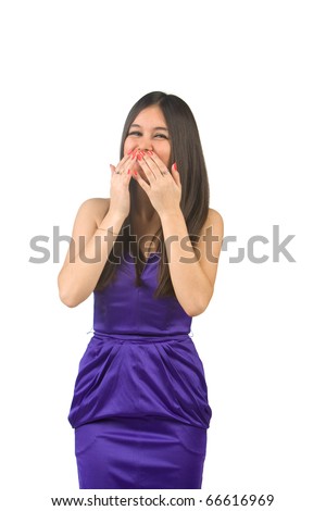 Beautiful Asian girl in a purple dress laughing on a white background