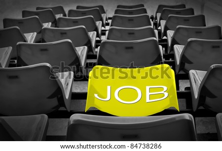 Yellow seat with new job wording in football stadium