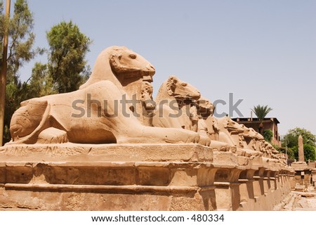 Ram headed sphinxes with statues of Pharaohs in front, Karnak Temple, Luxor, Egypt