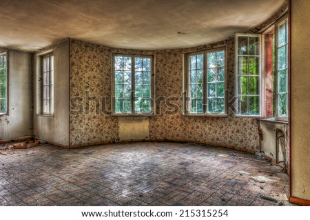 Dilapidated living room in an abandoned house, HDR
