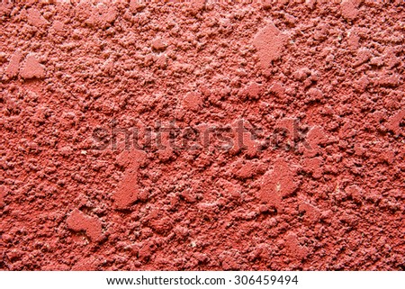 Red concrete wall background.Walls with rough surfaces.