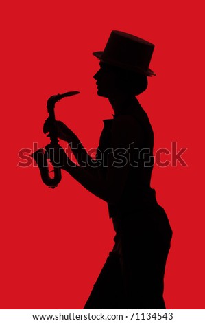 Silhouette of a woman with saxophone on red background
