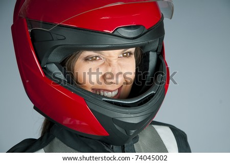 Portrait of attractive woman in motorbike helmet looking aside
