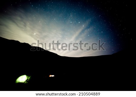 Camping under stars in mountains