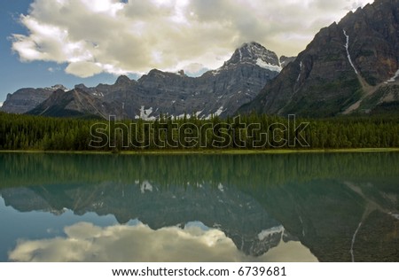 Waterfowl Lake, Banff National Park, Alberta - Mountains and clouds reflected in a calm lake