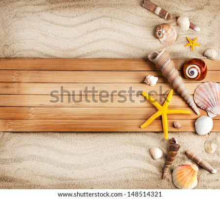 Few summer marine items on a sandy background.