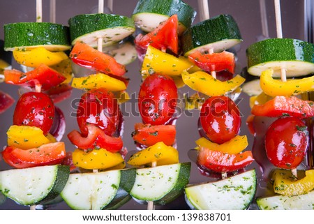 Fresh prepared vegetable skewers with tomato, pepper and zucchini