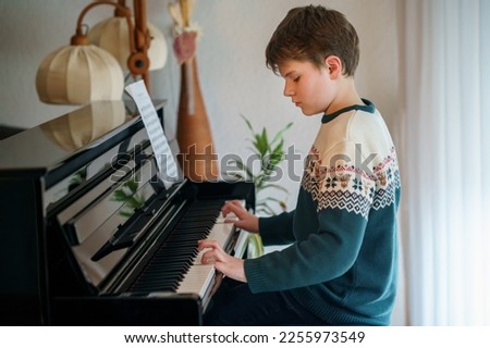 Similar – Image, Stock Photo boy plays piano Piano