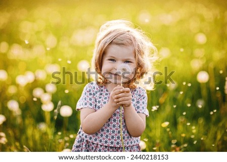 Similar – Image, Stock Photo Happy little girl with fringe hairstyle on the side in the lower part of the picture with view to the frame