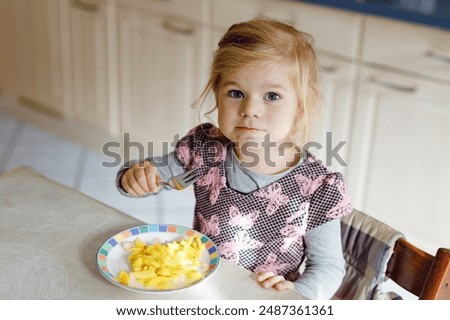 Similar – Image, Stock Photo portrait adorable child eating chocolate sponge cake