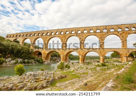 Pont du Gard is an old Roman aqueduct near Nimes in Southern France. Travel destination for tourists in Provence.