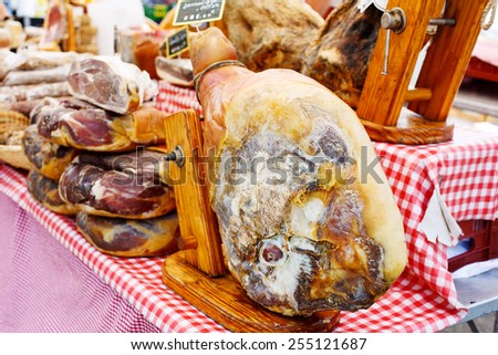 French jamon ham display in market in south of France, Arles, Provence. Local organic food.