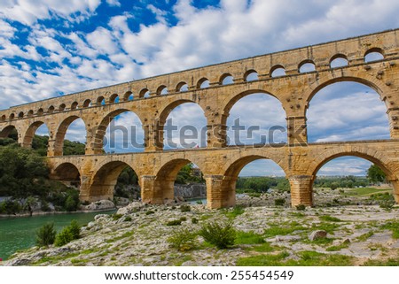 Pont du Gard is an old Roman aqueduct near Nimes in Southern France. Travel destination for tourists in Provence.