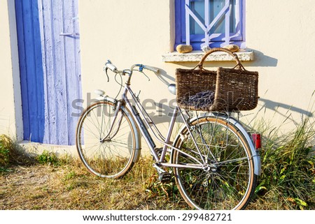 Farmer house and bicycle near lavender fields near Valensole in Provence, France. With bike, lavender bouquet in basket with typical provencal style.
