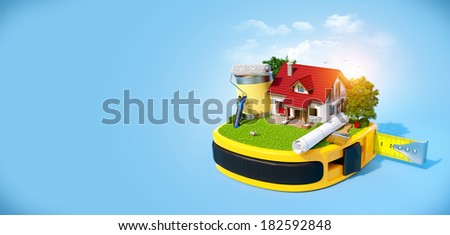 House with the yard and construction equipment on a tape measure. Construction concept