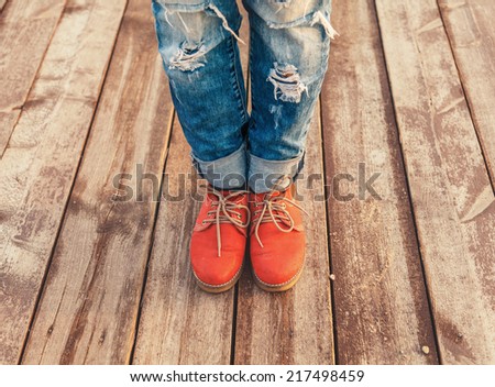 Woman\'s feet in a red shoes