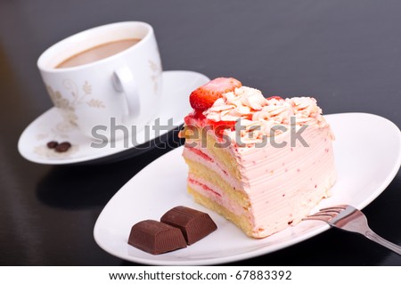 Strawberry cake - Strawberry cake dessert with cup of cafe on black background