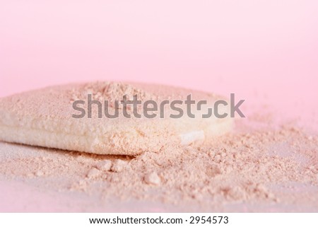 Cosmetic powder closeup on a table
