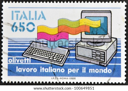 ITALY - CIRCA 1986: A stamp printed in Italy dedicated to Italian job for the world, shows a computer Olivetti, circa 1986