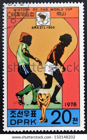 KOREA - CIRCA 1978: A Stamp printed in North Korea shows the Soccer players, Cup and Glob with the inscription \