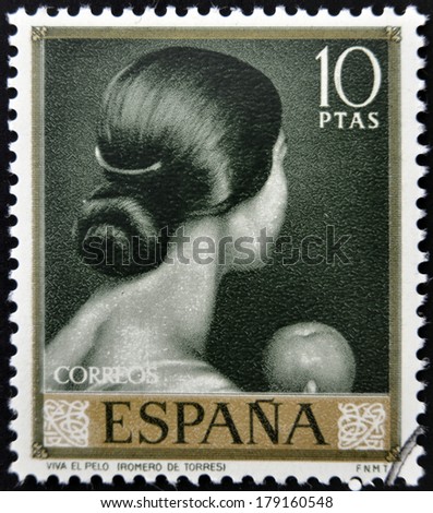 SPAIN - CIRCA 1965: stamp printed in Spain shows painting of Back of woman\'s head by Romero de Torres, circa 1965