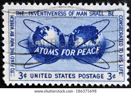 UNITED STATES OF AMERICA - CIRCA 1955: a stamp printed in USA shows Atomic Energy Encircling the Hemispheres, Atoms for Peace Policy, circa 1955