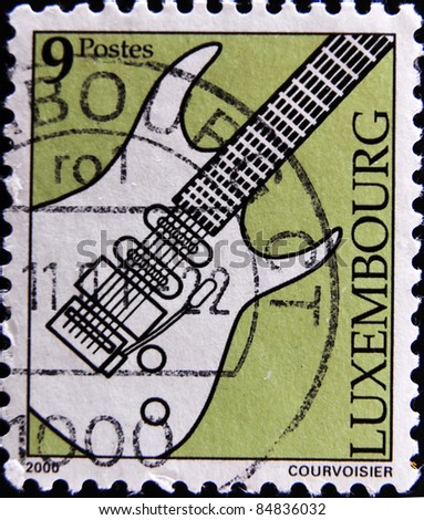 LUXEMBOURG  - CIRCA 2000: A stamp printed in Luxembourg shows an electric guitar, circa 2000