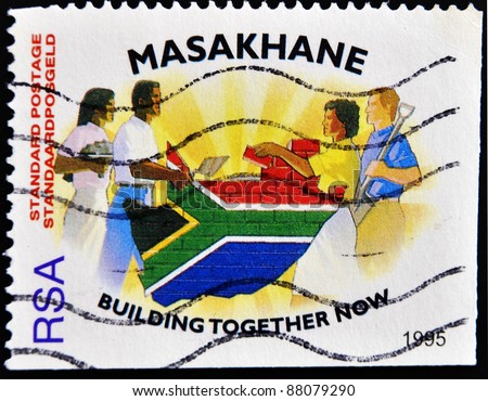 REPUBLIC OF SOUTH AFRICA - CIRCA 1995: A stamp printed in Republic of South Africa shows people of different races to build the country\'s flag, circa 1995