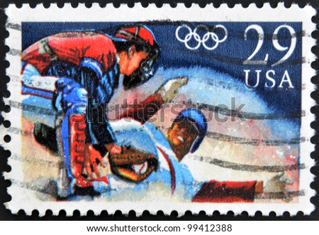 UNITED STATES OF AMERICA - CIRCA 1992: A stamp printed in USA shows Baseball, Runner sliding into home, circa 1992