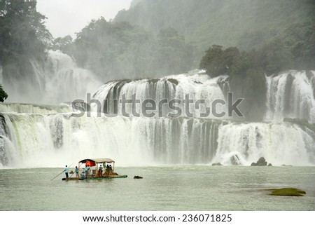 VIETNAM, CAO BANG, 15 AUGUST 2014 - Tourists at the boat close to Ban Gioc or Detian waterfall at the border between Vietnam and China