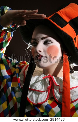 girl with clown makeup in fancy heat