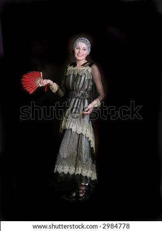 Standing girl with a red fan dress in  style of the beginning of XX century