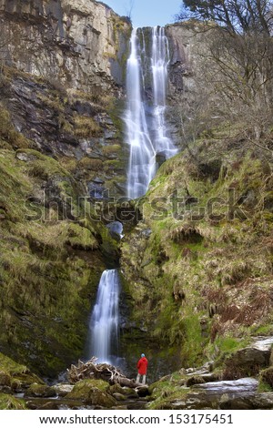 Pistyll Rhaeadr Waterfall in Powys in Wales. Formed by the Afon Disgynfa\'s falling, in three stages, over a 73m cliff-face. Note the natural arch in the middle.