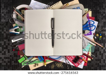 Selection of stationery for the office or for going back to school or college - Open book with space for text.